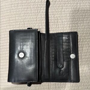 Black leather clutch/crossbody wallet.